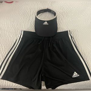 Small Adidas shorts and visor